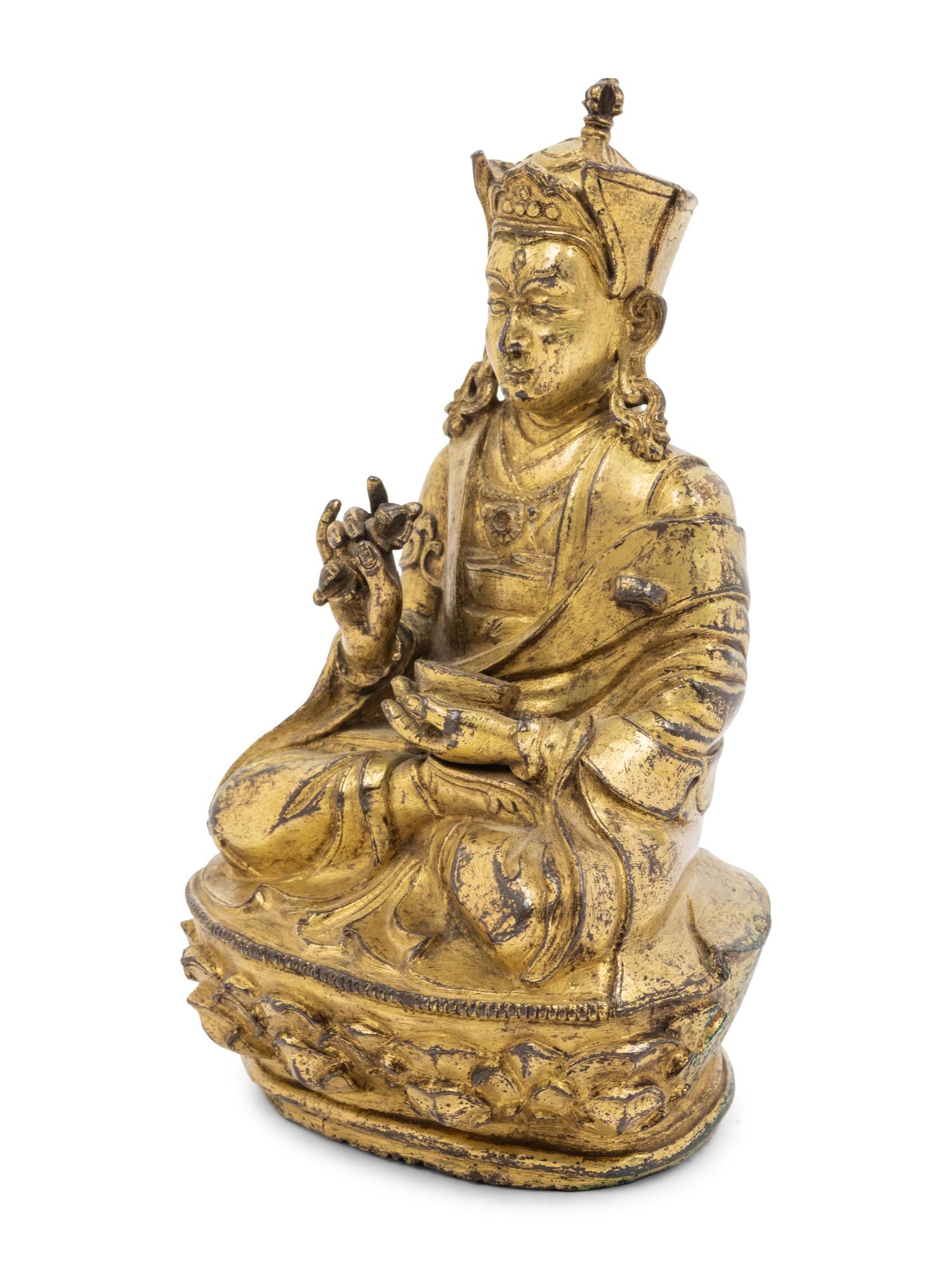 A Tibetan Gilt Bronze Figure of a Seated Karmapa