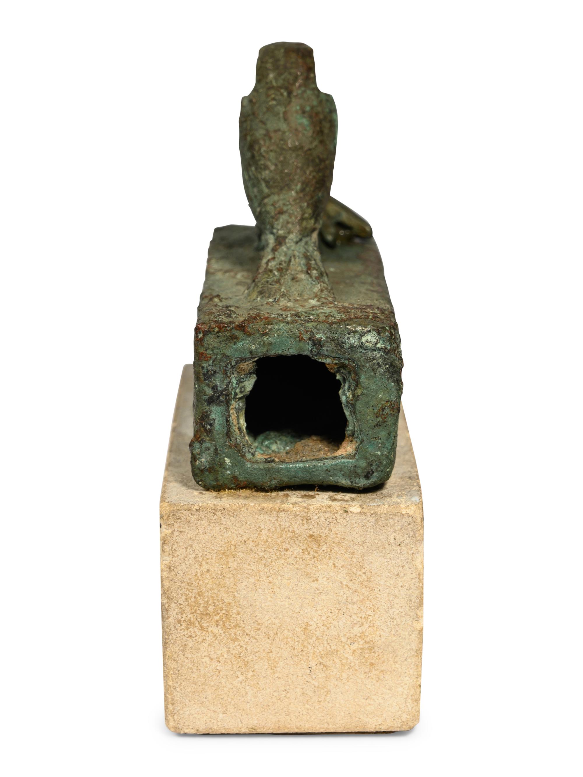 An Egyptian Bronze Falcon Coffin