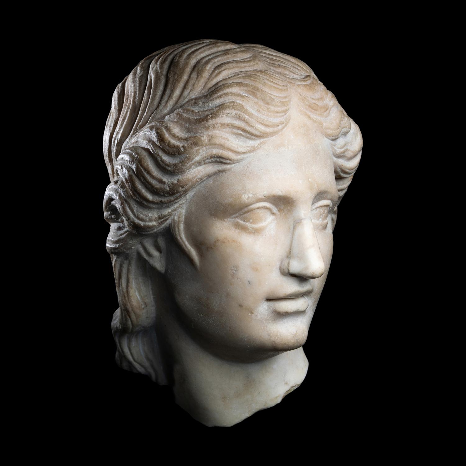 A Roman Marble Head of a Goddess or Youthful God