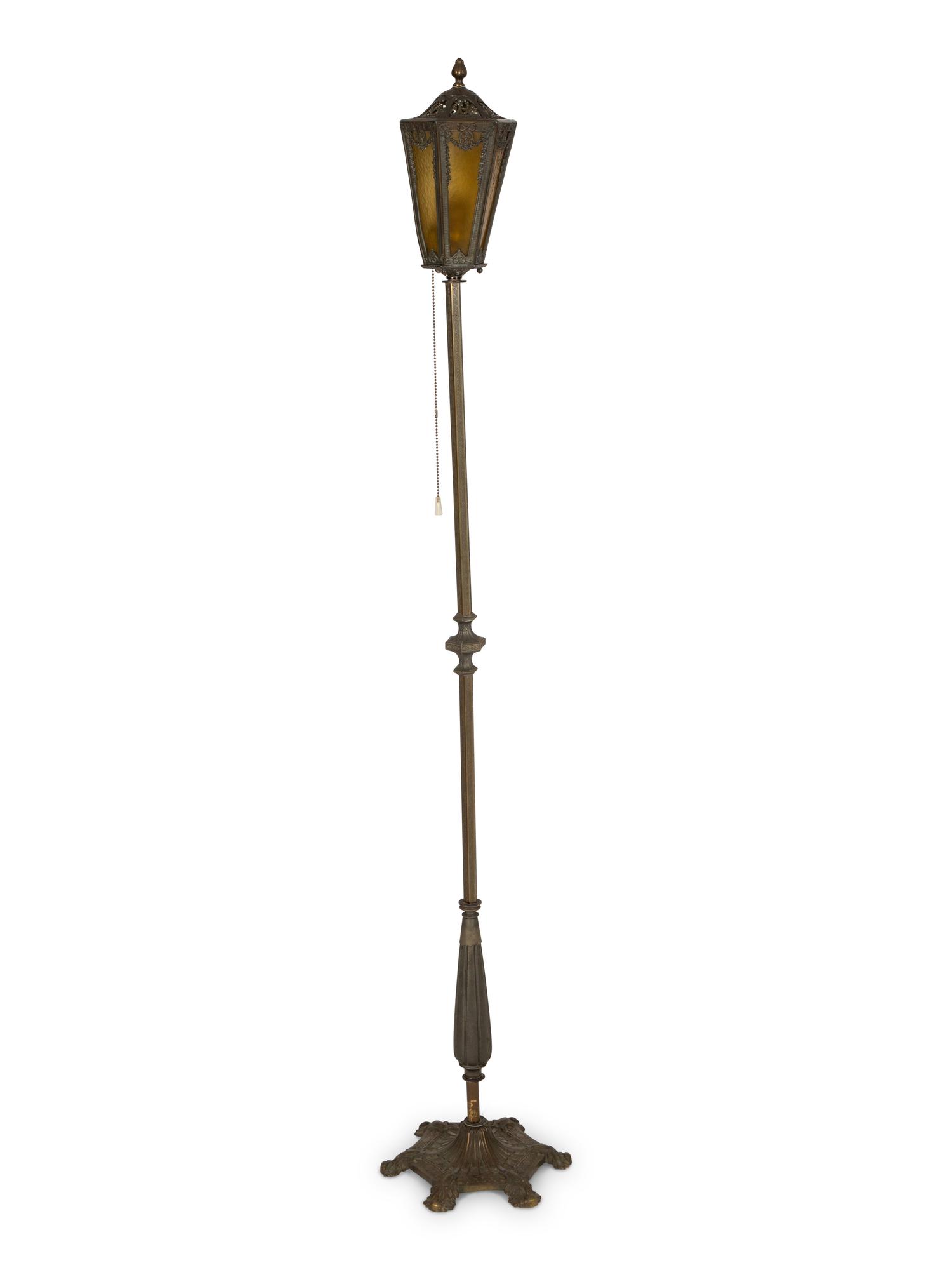 A Pair of Patinated Metal Lantern Style Floor Lamps
