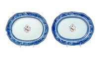 A Pair of Chinese Export Porcelain Armorial Platters Raised on Later Mahogany Stands