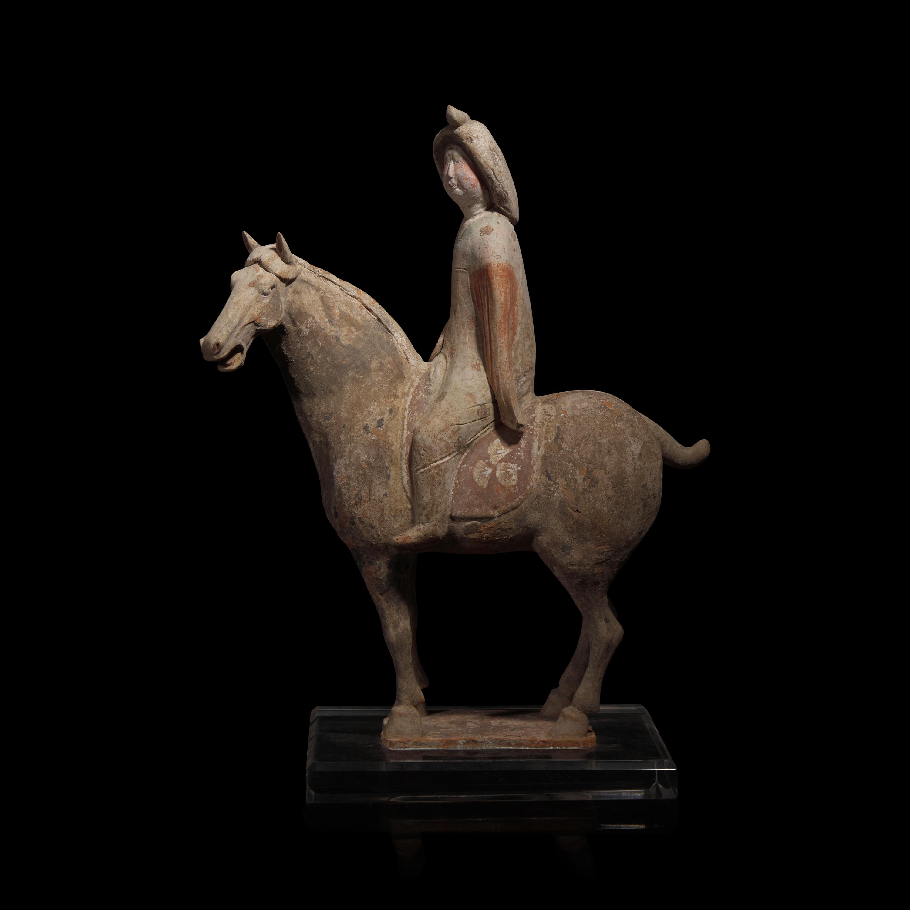 A Chinese Painted Pottery Female Equestrian Figure, Tang Dynasty — 唐 陶加彩女騎馬俑