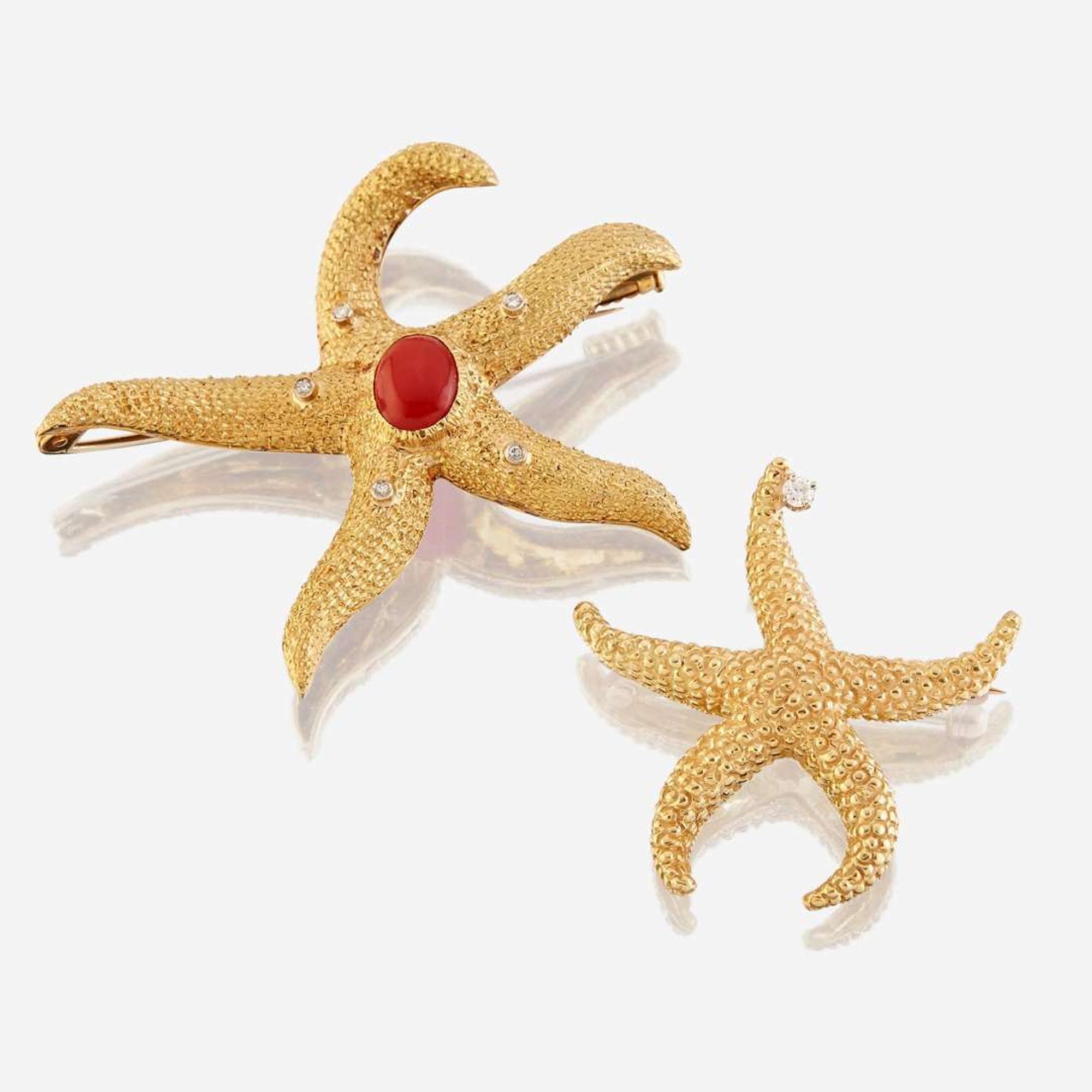 A group of two eighteen karat gold and gem-set brooches