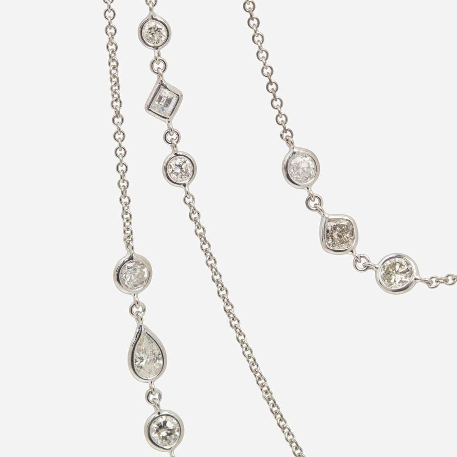 An 18K White Gold Diamond Long Station Chain