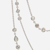 An 18K White Gold Diamond Long Station Chain