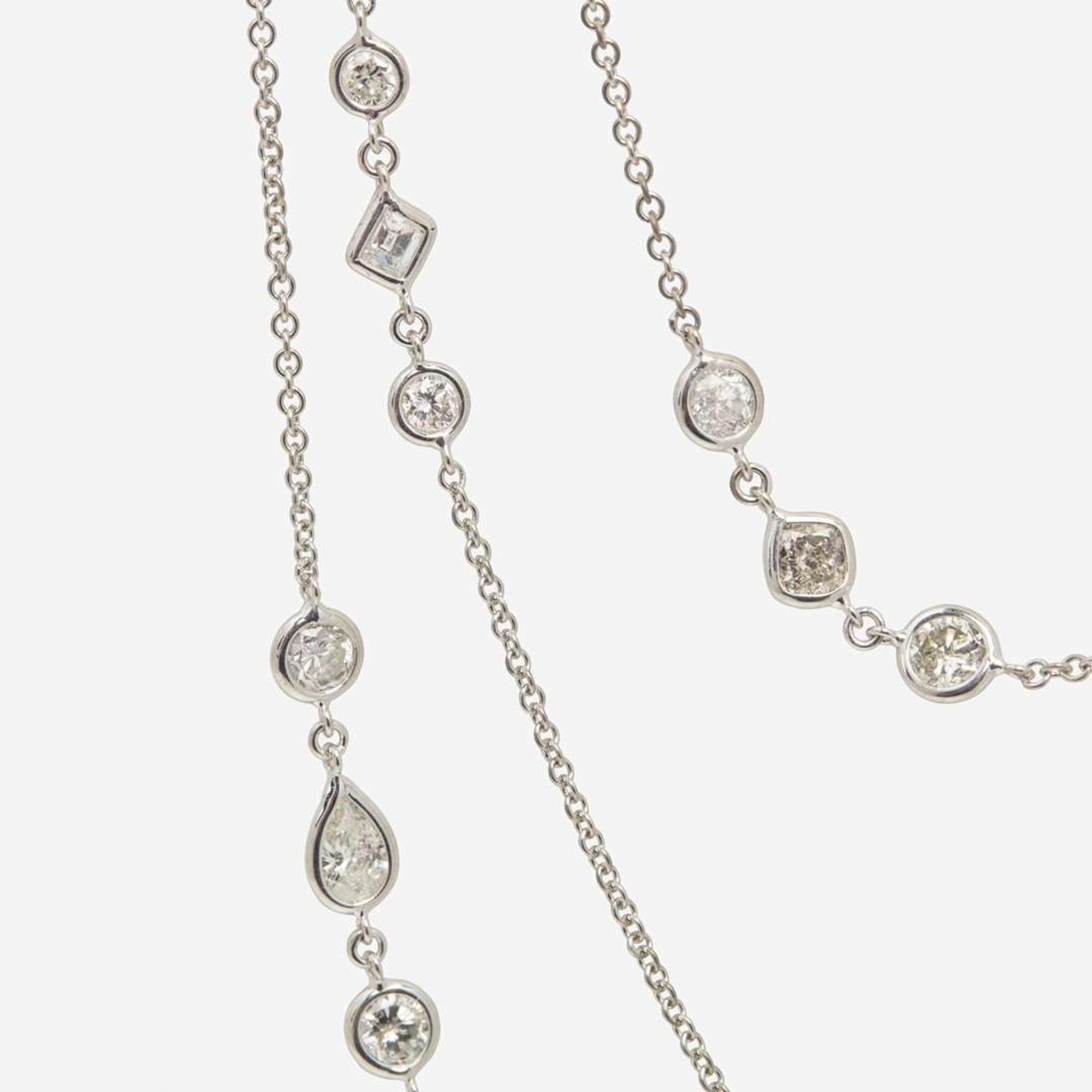 An 18K White Gold Diamond Long Station Chain