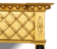 A French Egyptian Revival Giltwood Mirror