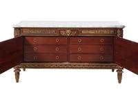 A Louis XVI Style Gilt Bronze Mounted Mahogany Marble-Top Commode à Vantaux After the Model by Guillaume Benneman