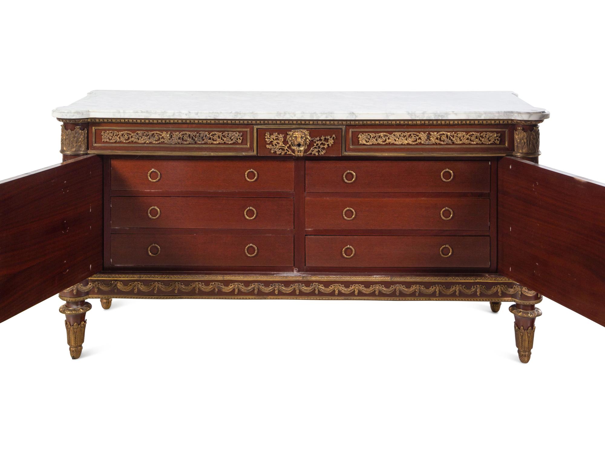 A Louis XVI Style Gilt Bronze Mounted Mahogany Marble-Top Commode à Vantaux After the Model by Guillaume Benneman