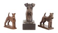 A Group of Three Airedale Terrier Bronze Figures Height of tallest 7 1/4 inches.
