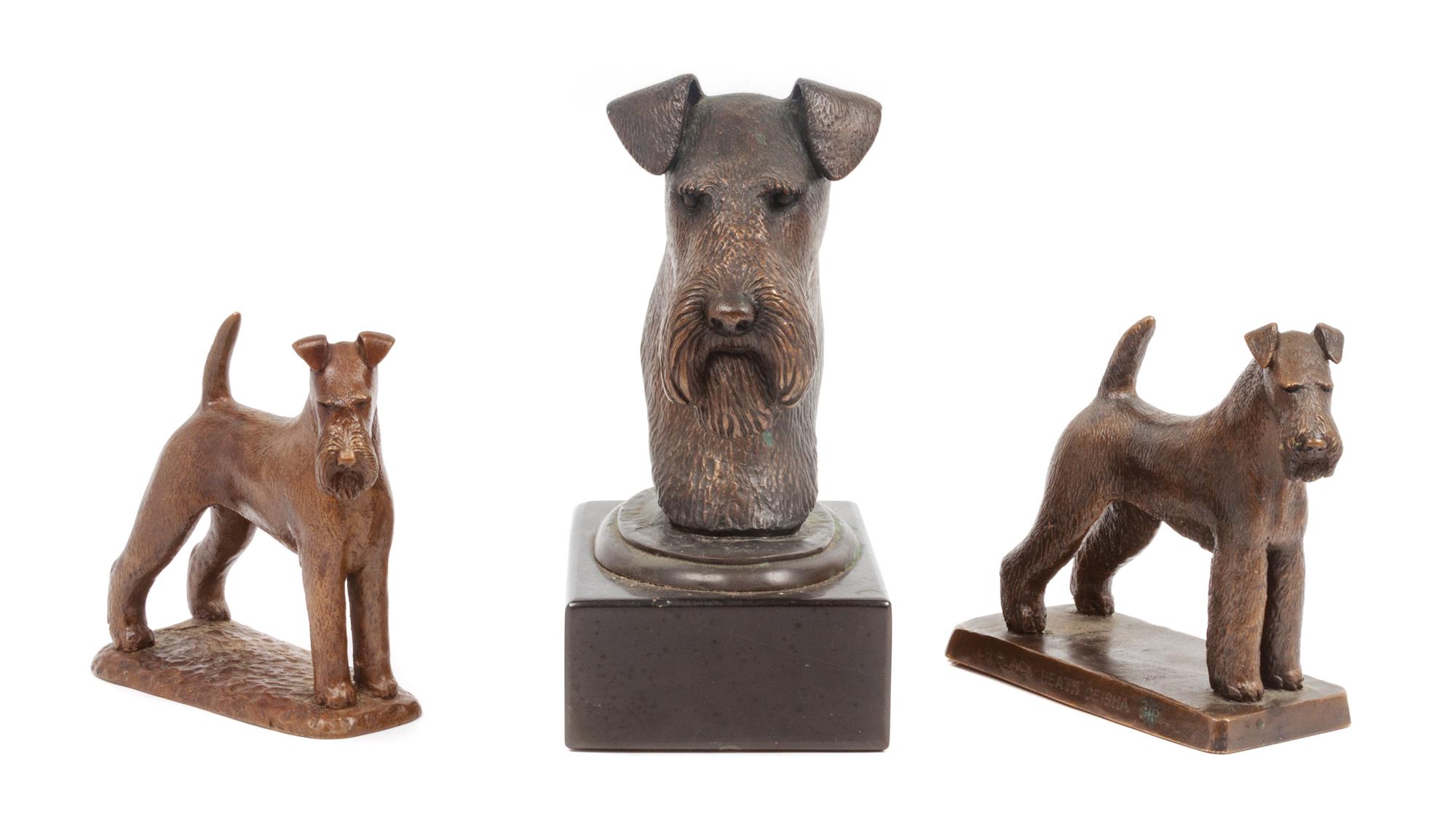 A Group of Three Airedale Terrier Bronze Figures Height of tallest 7 1/4 inches.