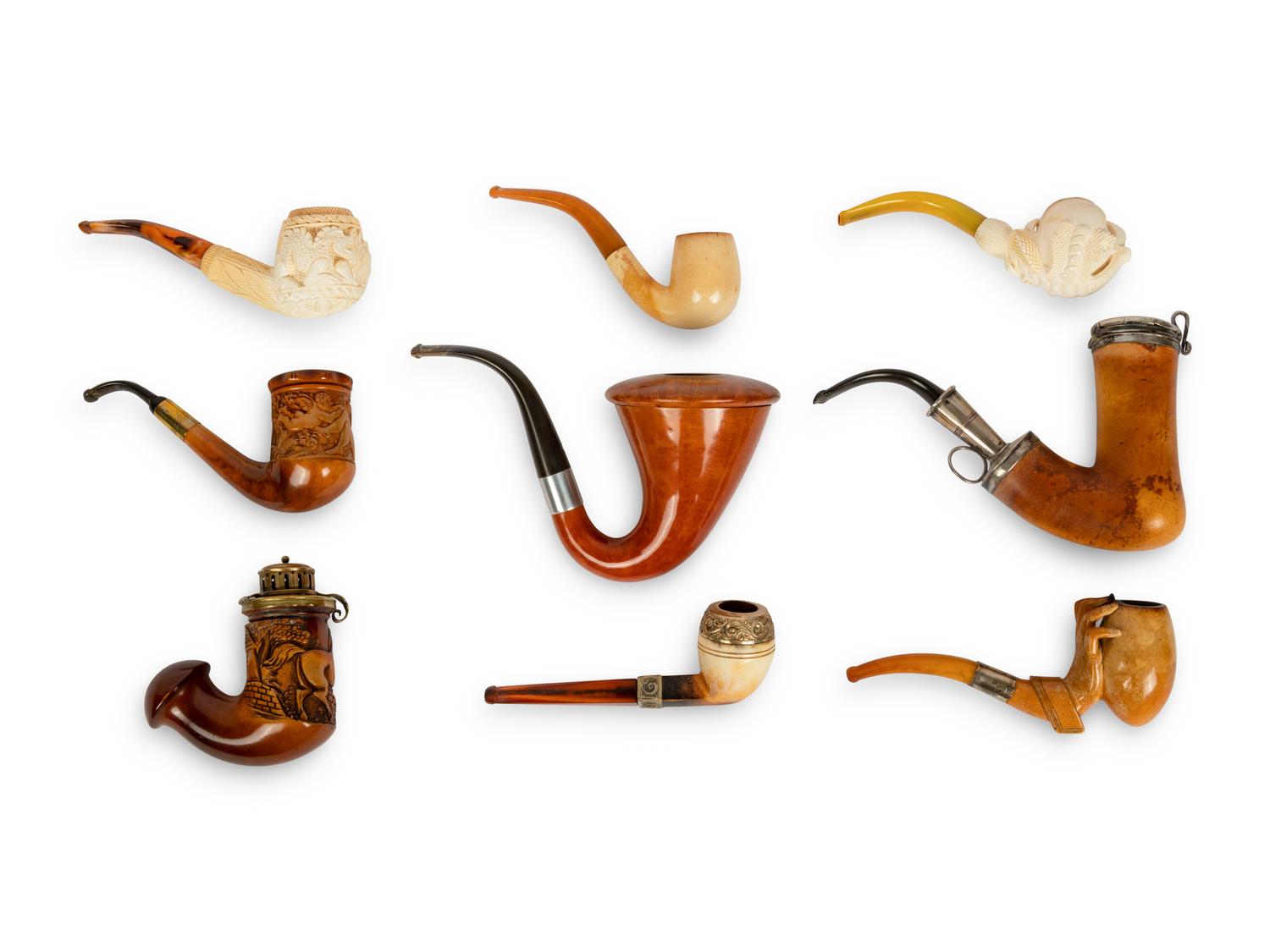 A Group of Nine Carved Meerschaum and Wooden Pipes