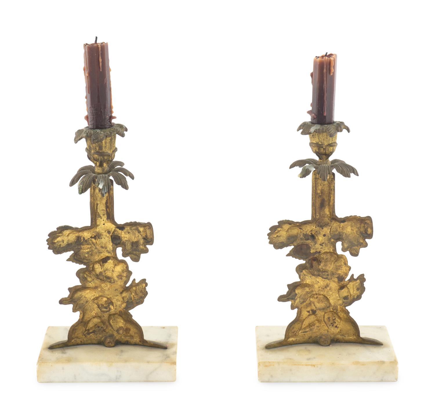 A Pair of Gilt Metal Candlesticks