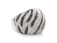 A White Gold, Diamond and Black Diamond Swirl Motif Ring, 11.40 dwts.