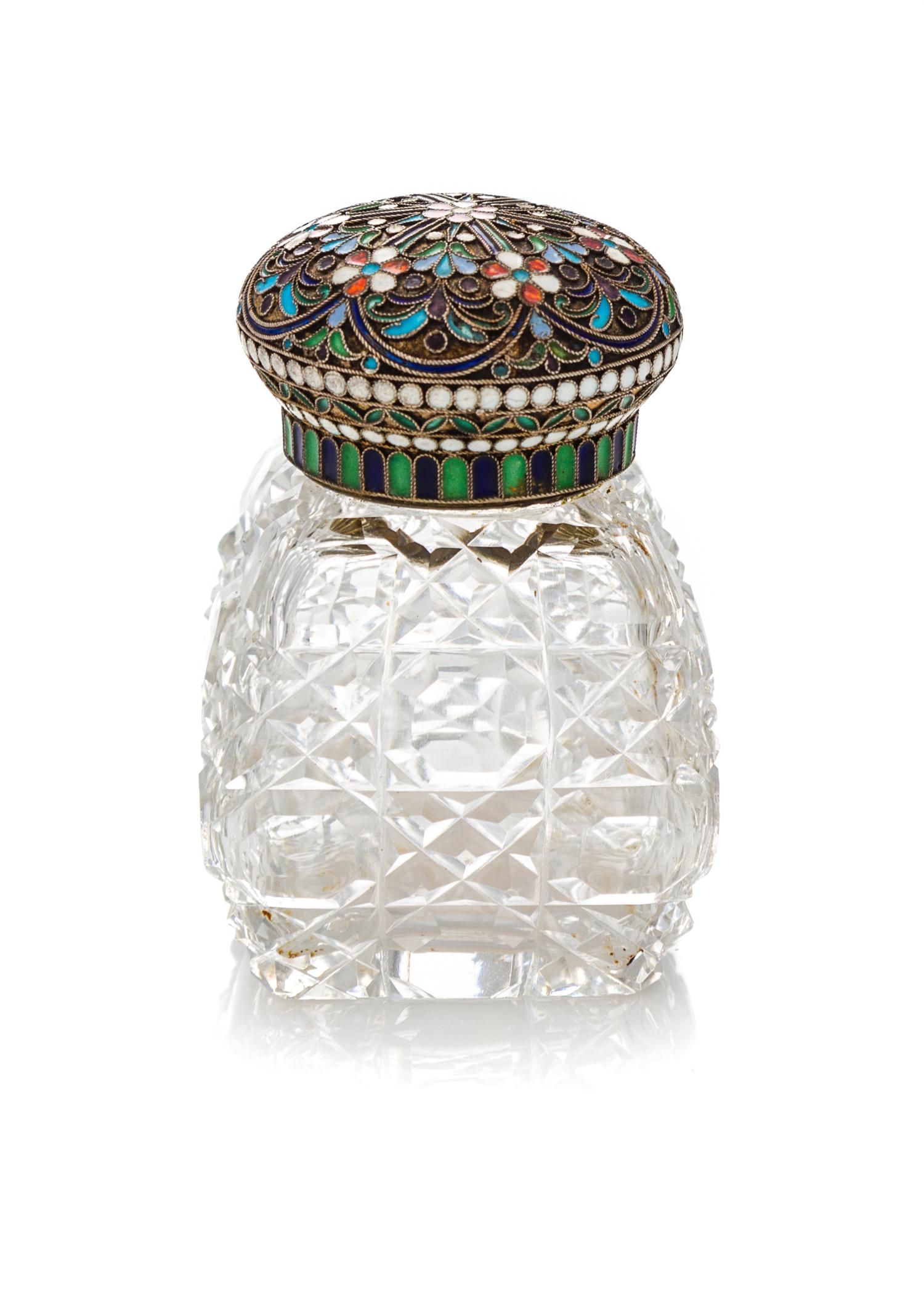 A Russian Enameled Silver and Cut Glass Scent Bottle, 19th Century, having a circular lid decorated with stylized floral decoration sur