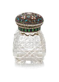 A Russian Enameled Silver and Cut Glass Scent Bottle, 19th Century, having a circular lid decorated with stylized floral decoration sur