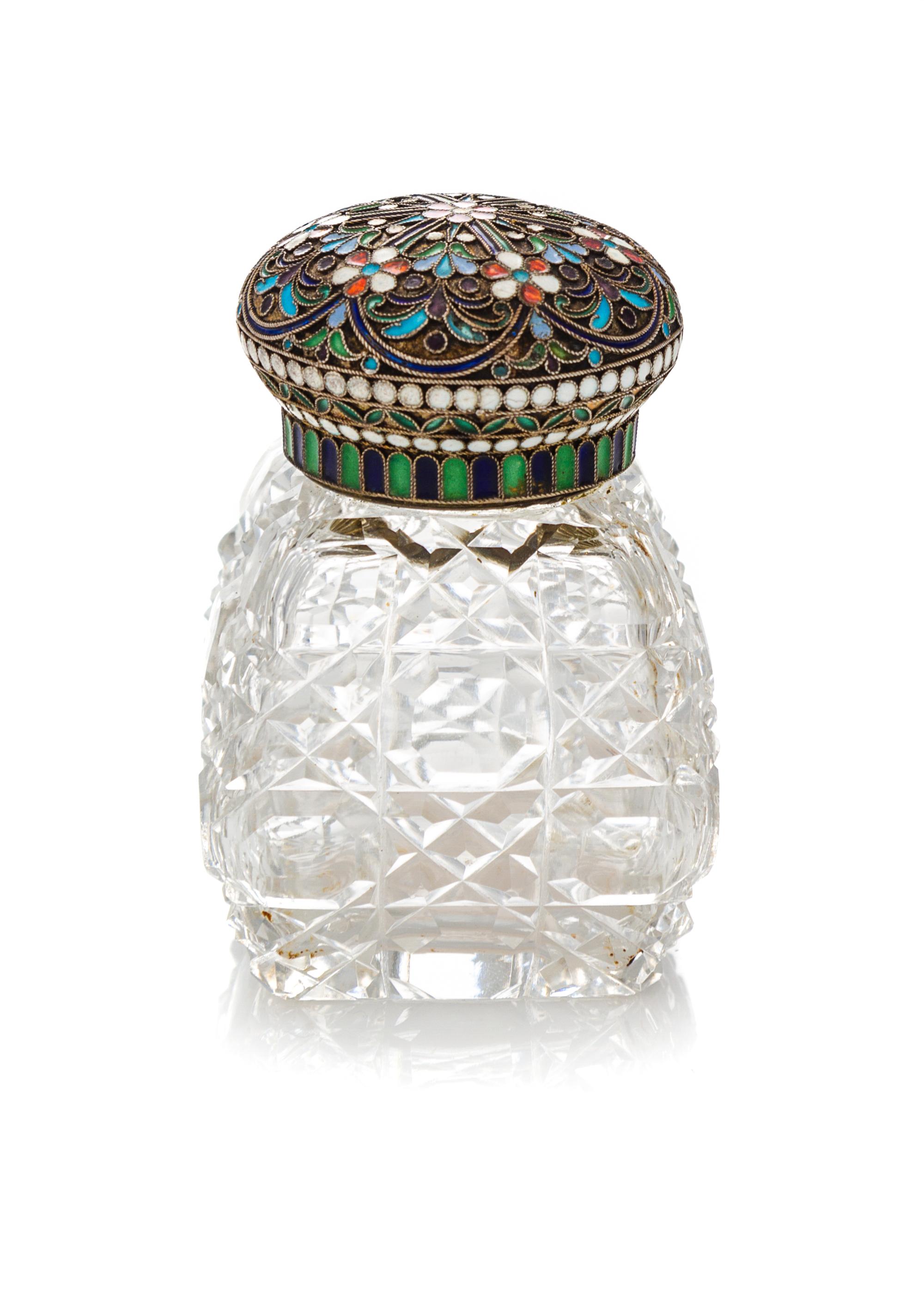 A Russian Enameled Silver and Cut Glass Scent Bottle, 19th Century, having a circular lid decorated with stylized floral decoration sur