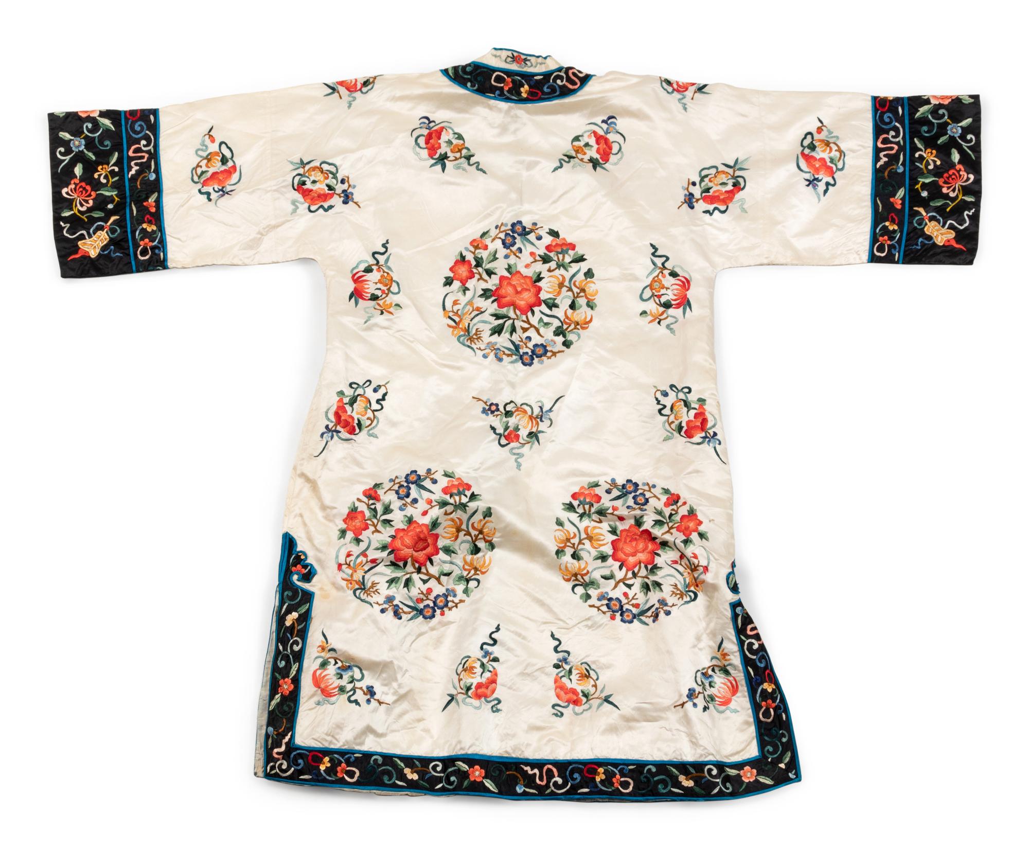 A Chinese White Ground Embroidered Silk Lady's Robe