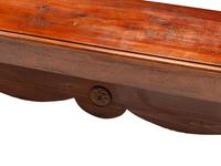 An English Baroque Style Walnut Trestle Table and a Pair of Associated Benches