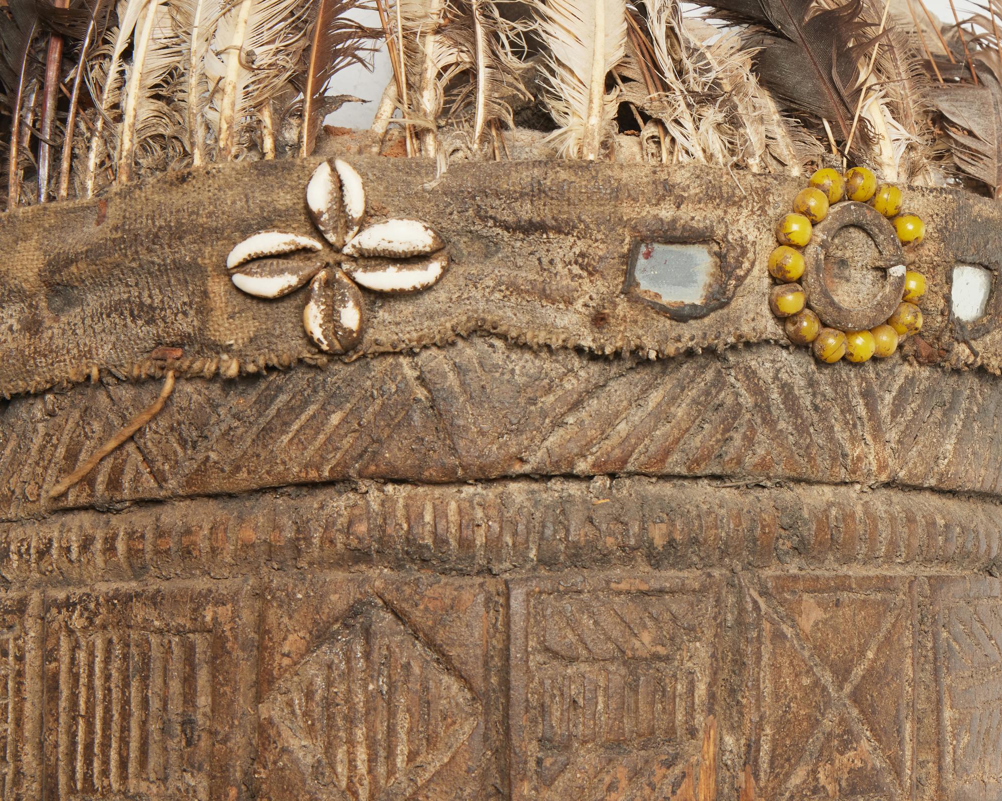 Primitive Mask with Feather and Fetishes