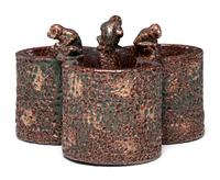 A Glazed Sewer Tile Trefoil Vase or Planter with Seated Monkeys