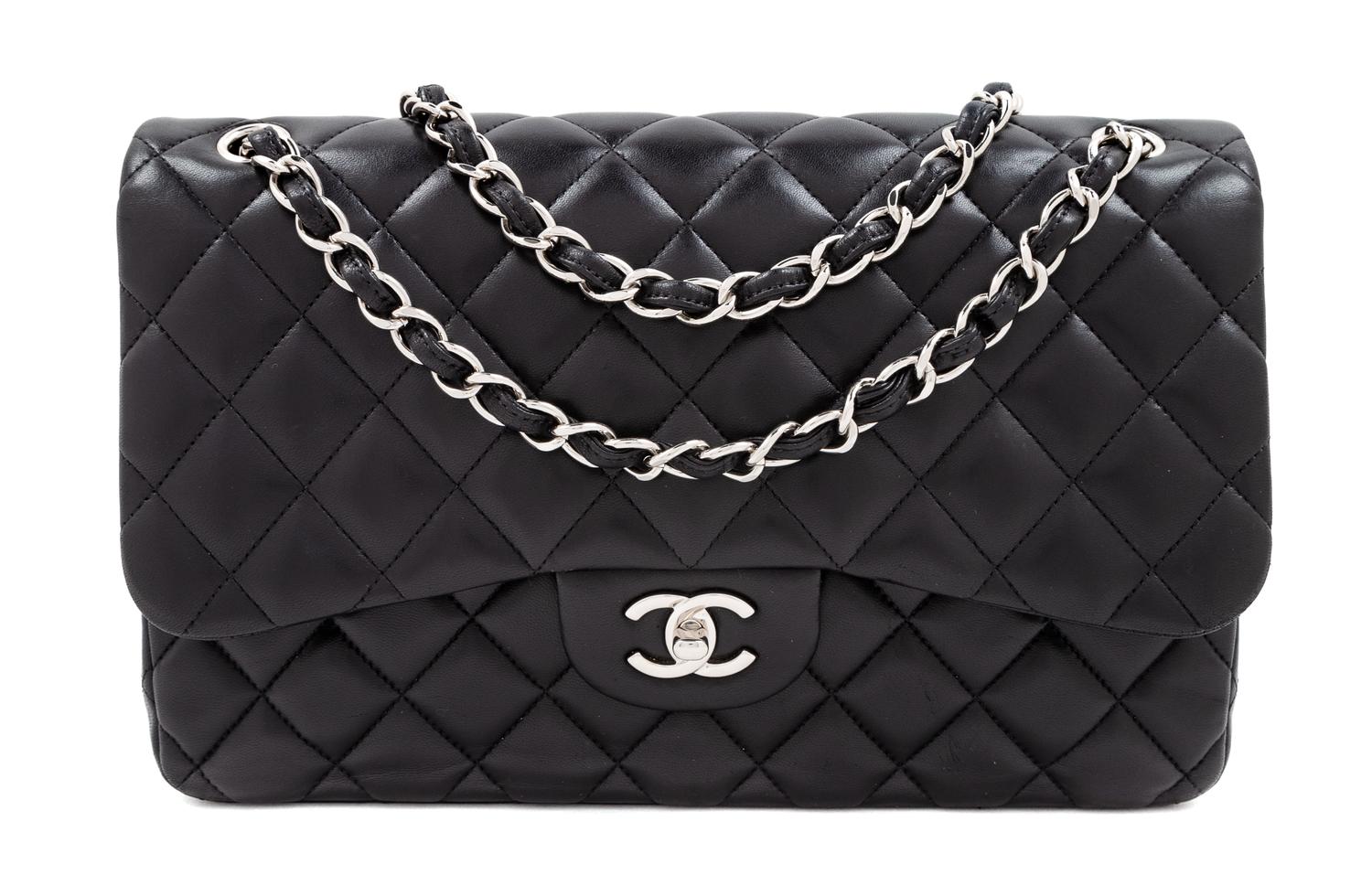 A Chanel Black Quilted Lambskin Jumbo Double Flap Bag, 8.25" H x 12" W x 3.5" D; Strap drop: 13.5"- 23.75".