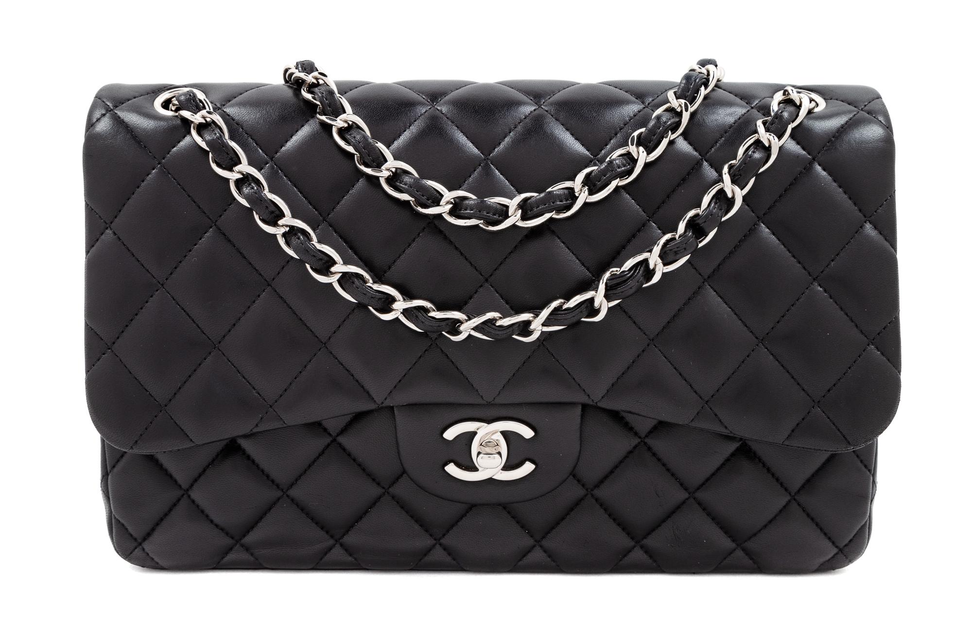 A Chanel Black Quilted Lambskin Jumbo Double Flap Bag, 8.25" H x 12" W x 3.5" D; Strap drop: 13.5"- 23.75".