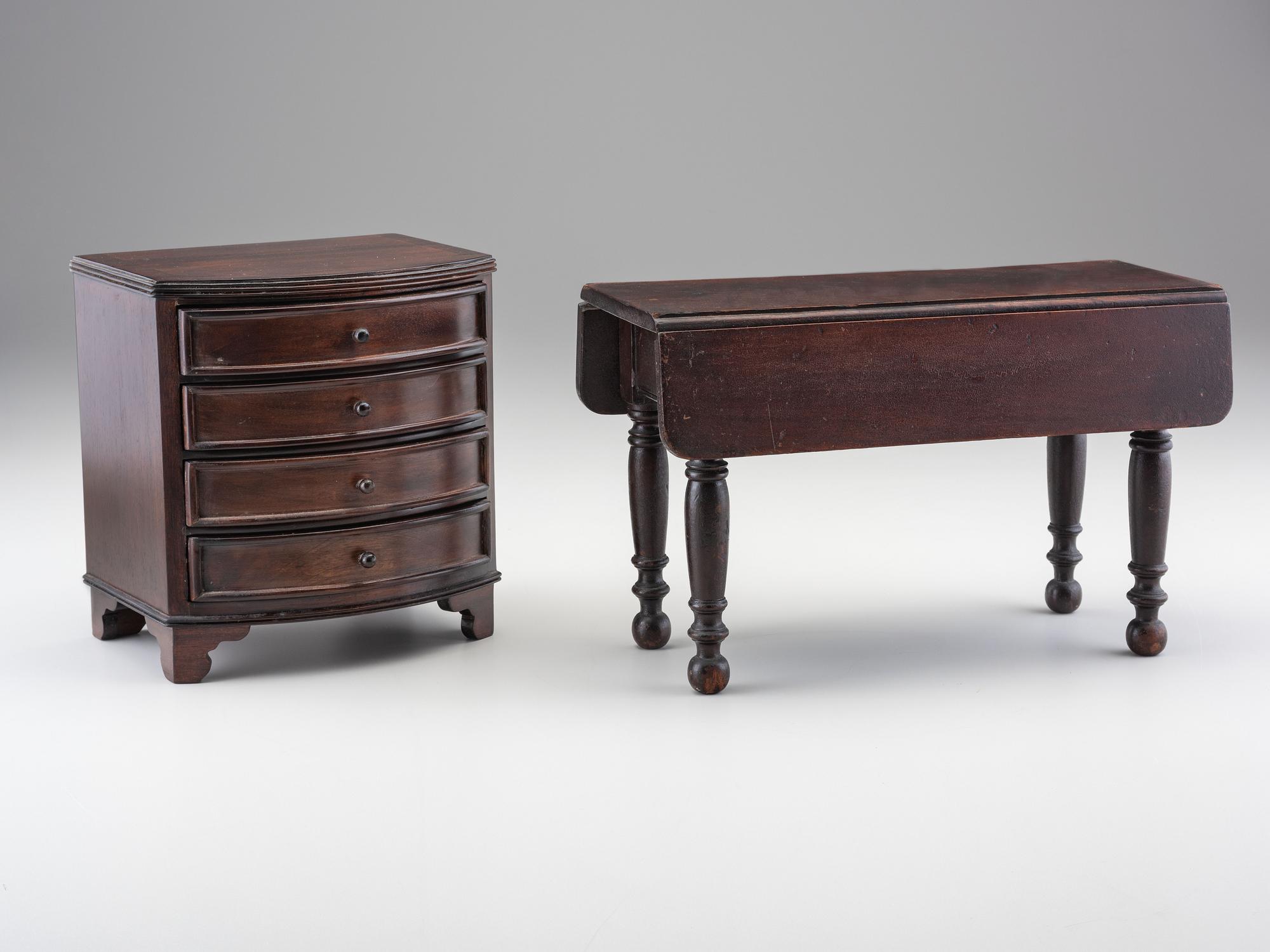 A Miniature Bow Front Chest of Drawers and Drop-Leaf Dining Table