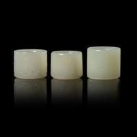 Three Chinese White Jade 'Double Happiness' Archer’s Rings, 19th Century 清晚期 白玉’雙喜‘扳指組三枚