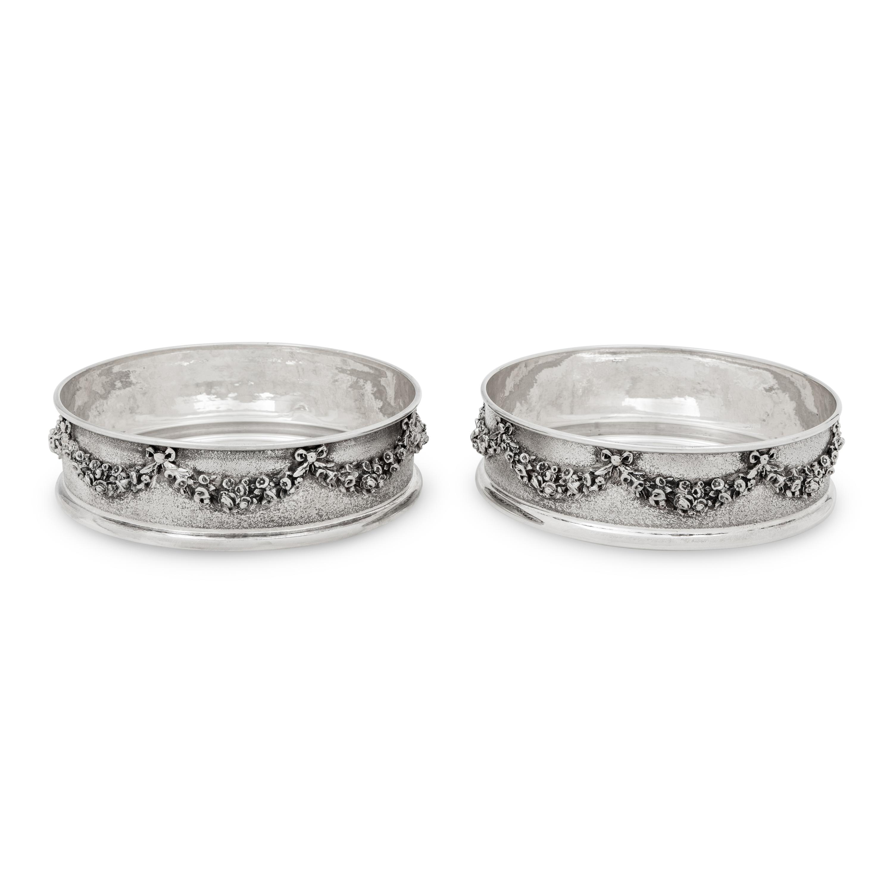 A Pair of Greek Silver Bottle Coasters