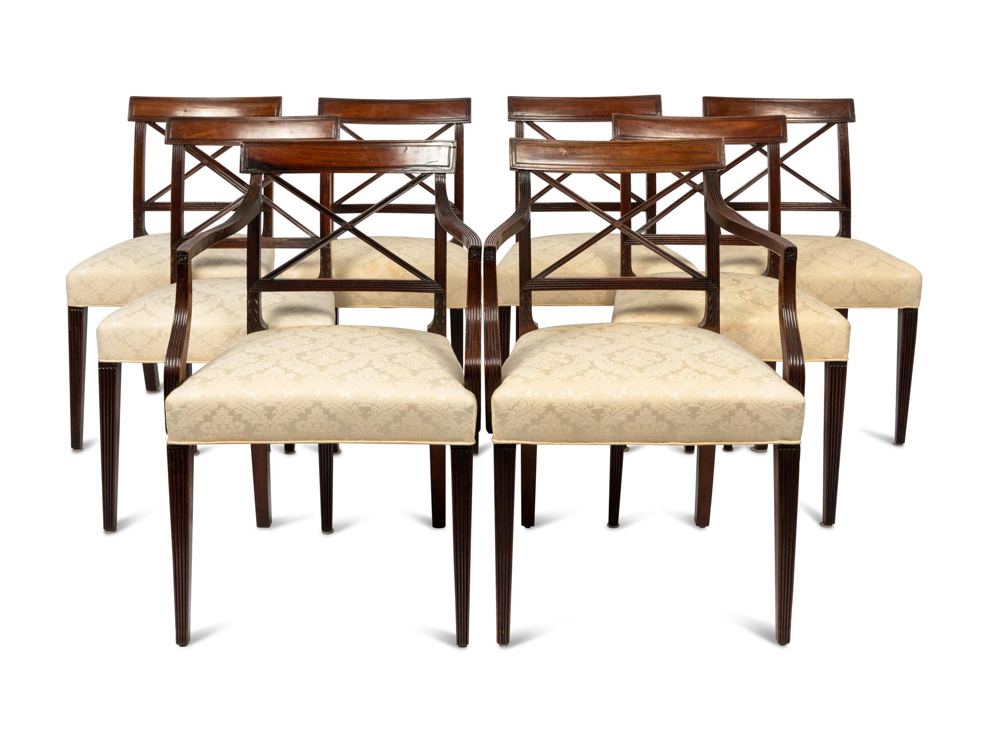 A Set of Six Regency Style Mahogany Dining Chairs and Two Armchairs