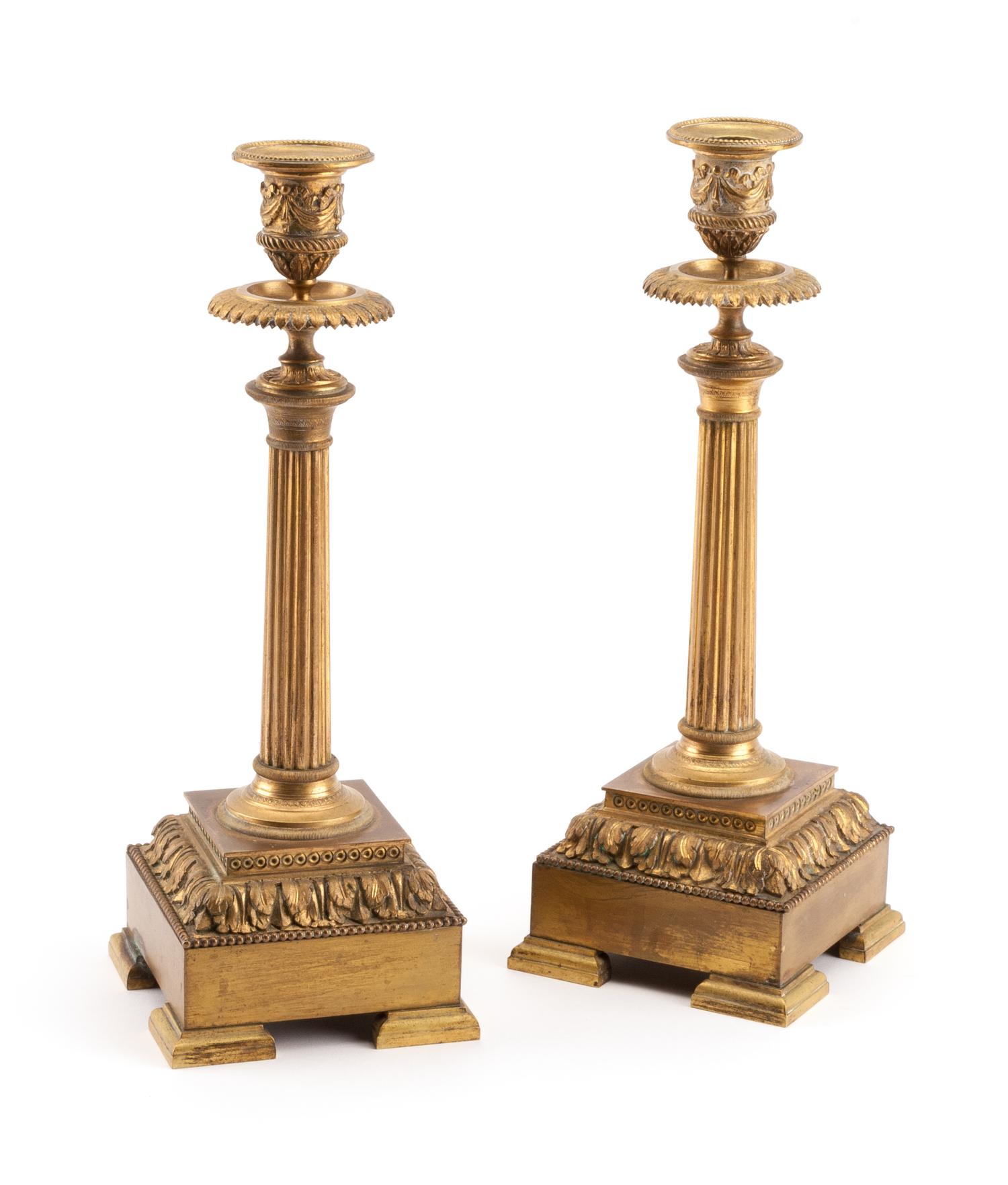 A Pair of Louis XVI Style Gilt Bronze Candlesticks Height 12 inches. — 19TH CENTURY
