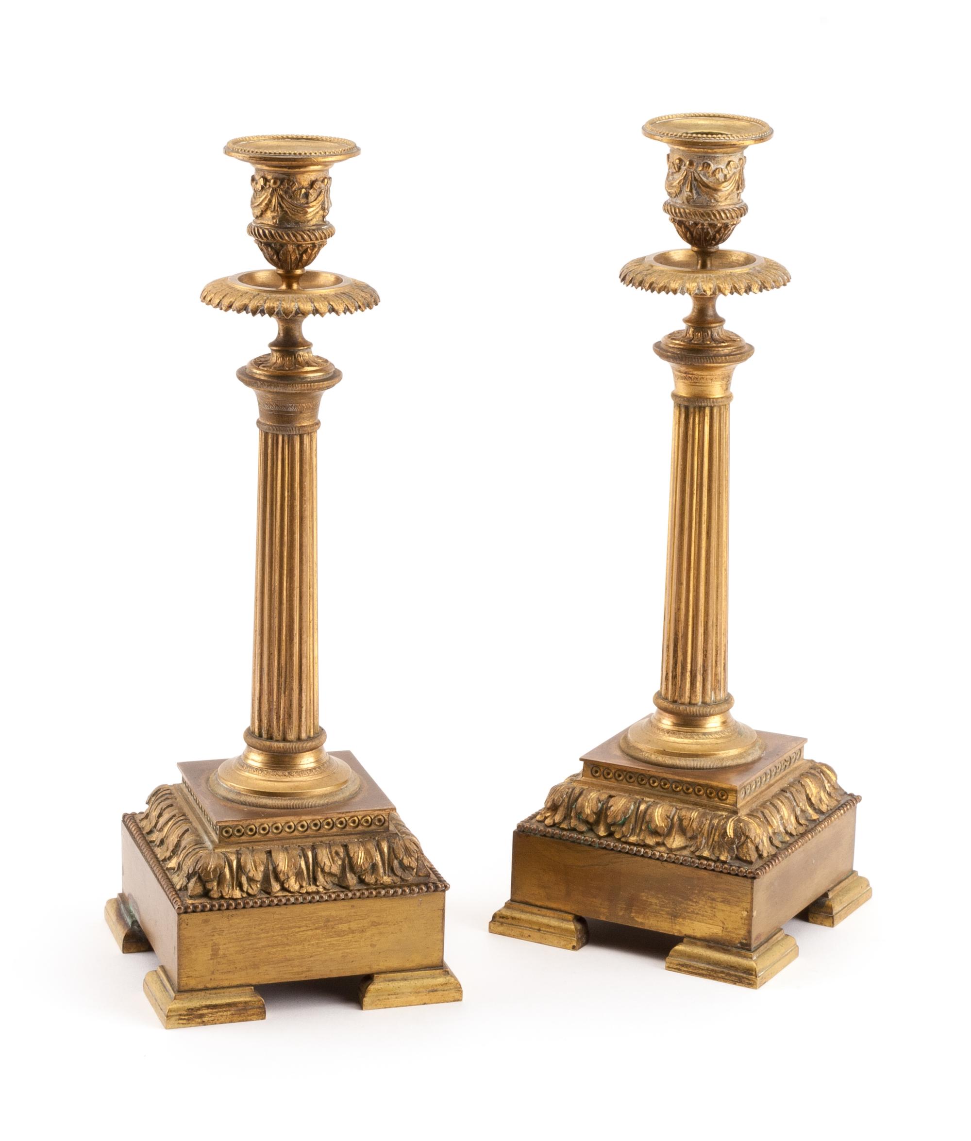 A Pair of Louis XVI Style Gilt Bronze Candlesticks Height 12 inches. — 19TH CENTURY