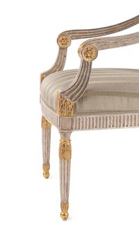 A Set of Six Neoclassical Carved and Parcel Gilt Dining Chairs