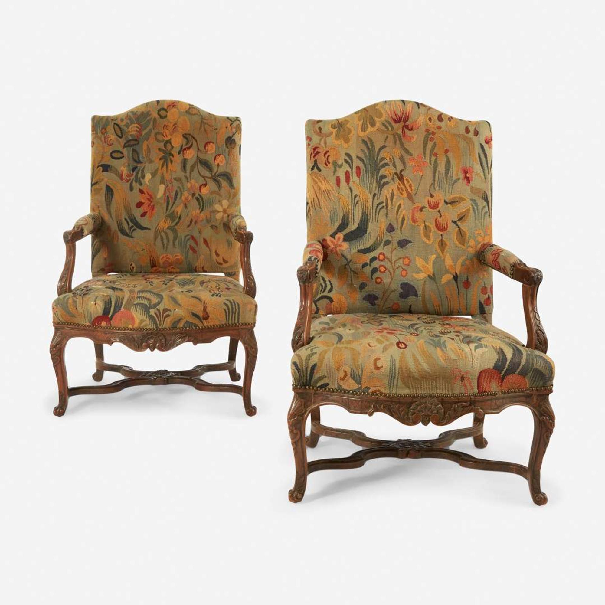 A Pair of French Régence Carved Walnut Bergères 18th century