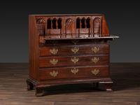 A Chippendale Figured and Shell-Carved Mahogany Slant Front Desk