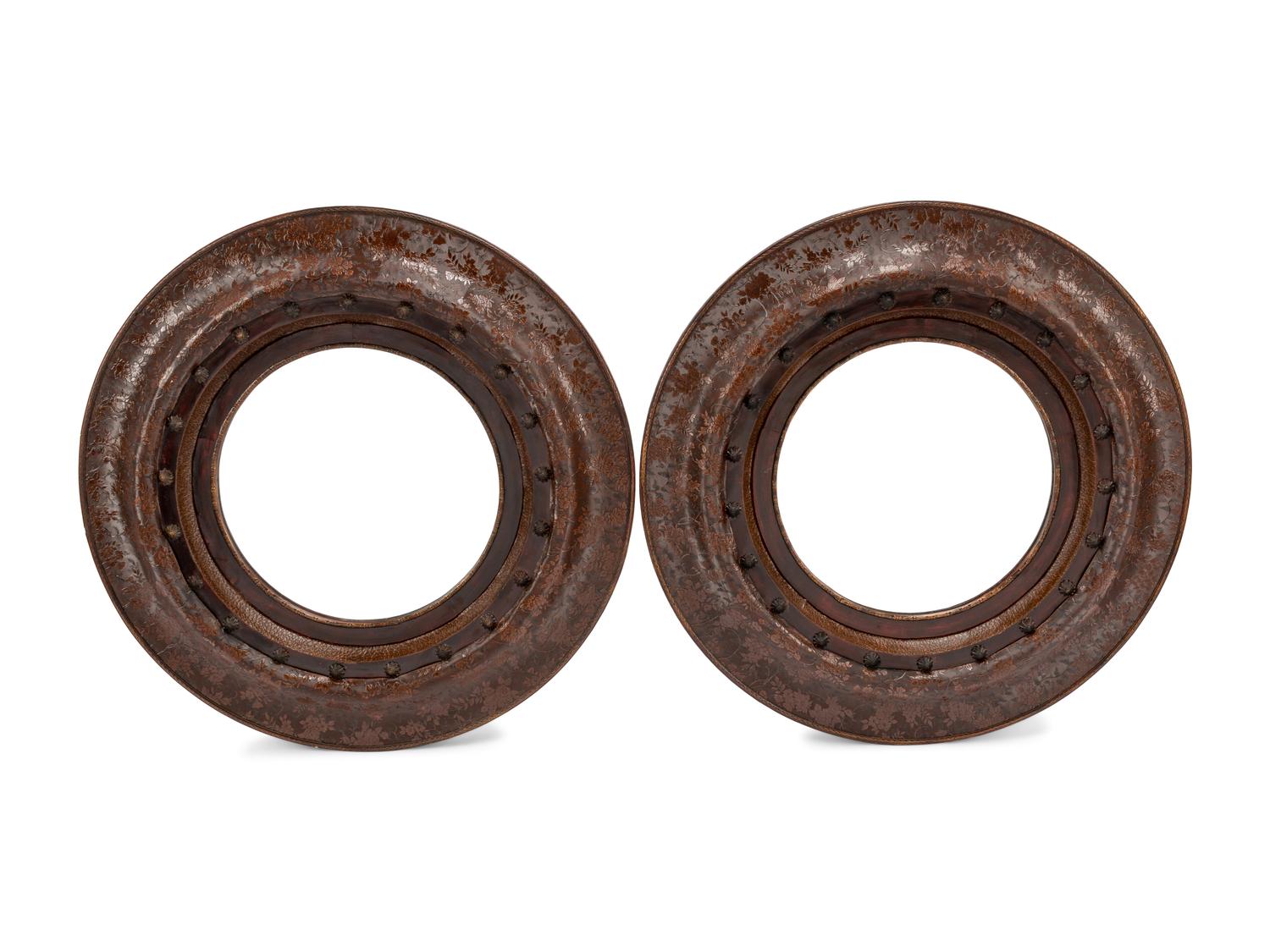 A Pair of Portuguese Embossed Leather Circular Mirrors