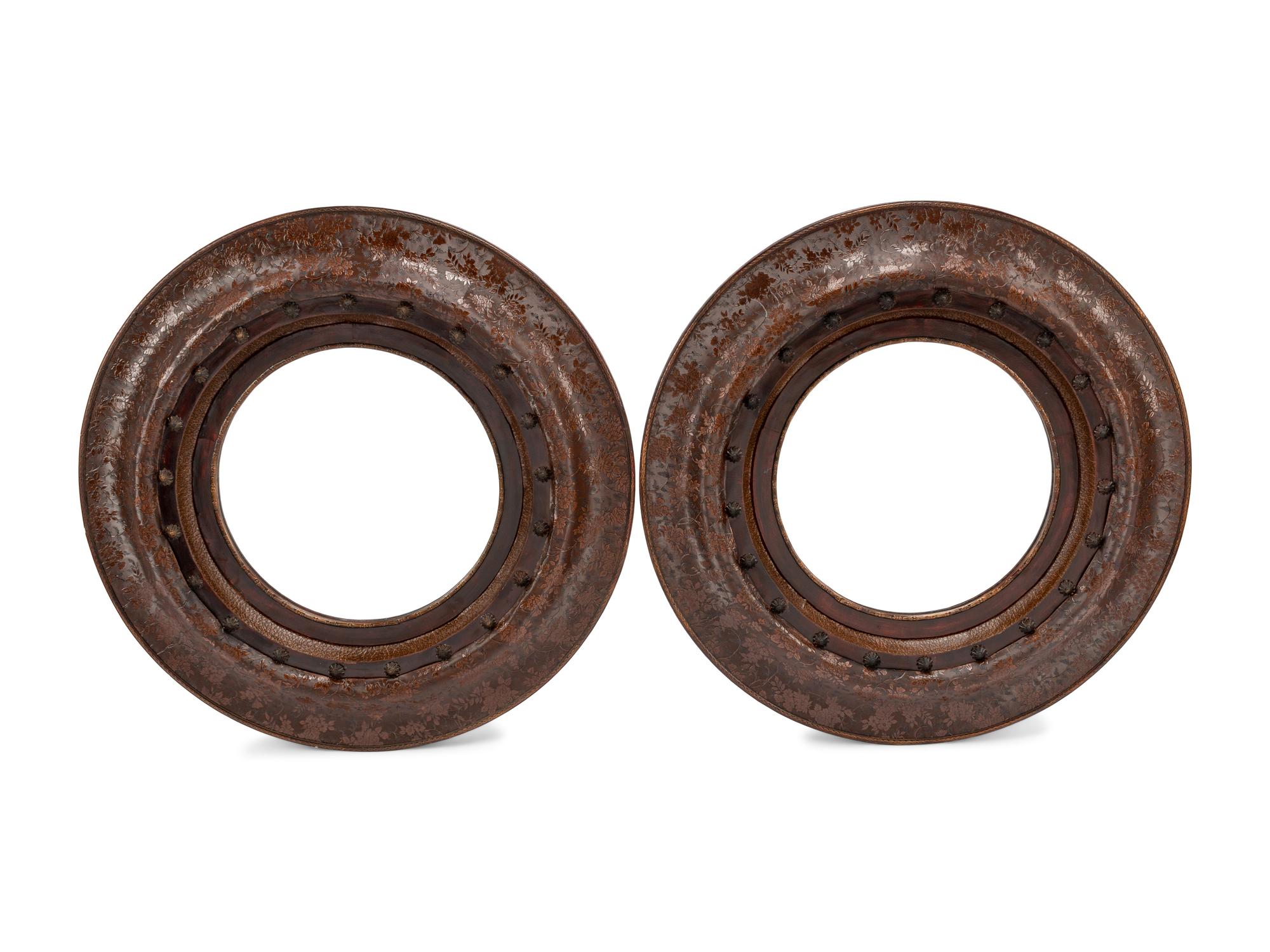 A Pair of Portuguese Embossed Leather Circular Mirrors