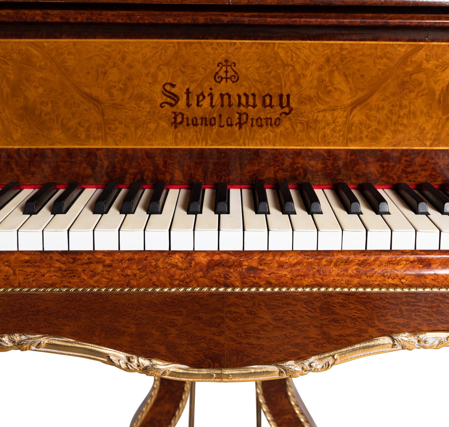 A Louis XV Style Gilt Metal Mounted Burlwood Piano