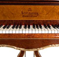 A Louis XV Style Gilt Metal Mounted Burlwood Piano