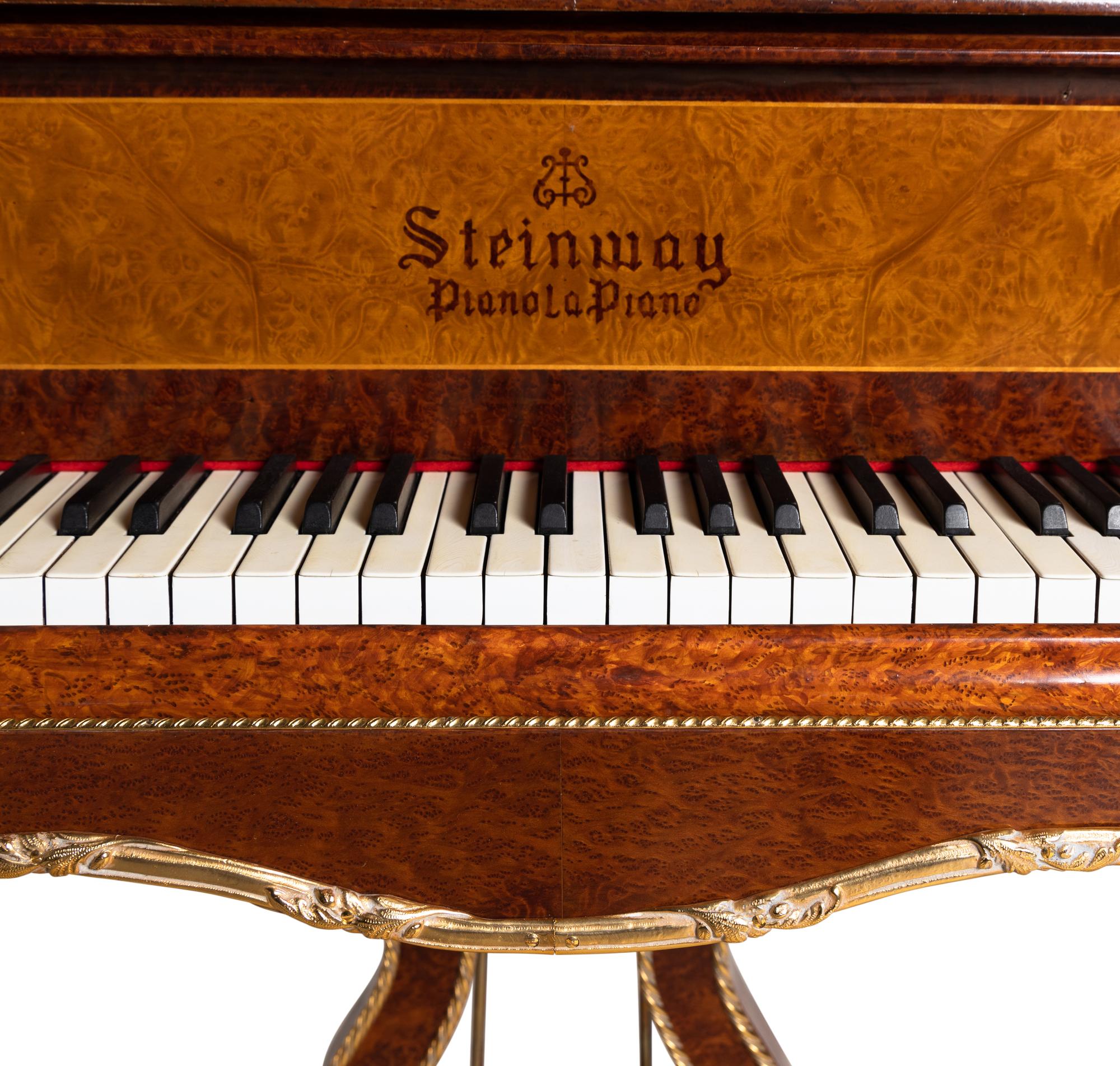 A Louis XV Style Gilt Metal Mounted Burlwood Piano