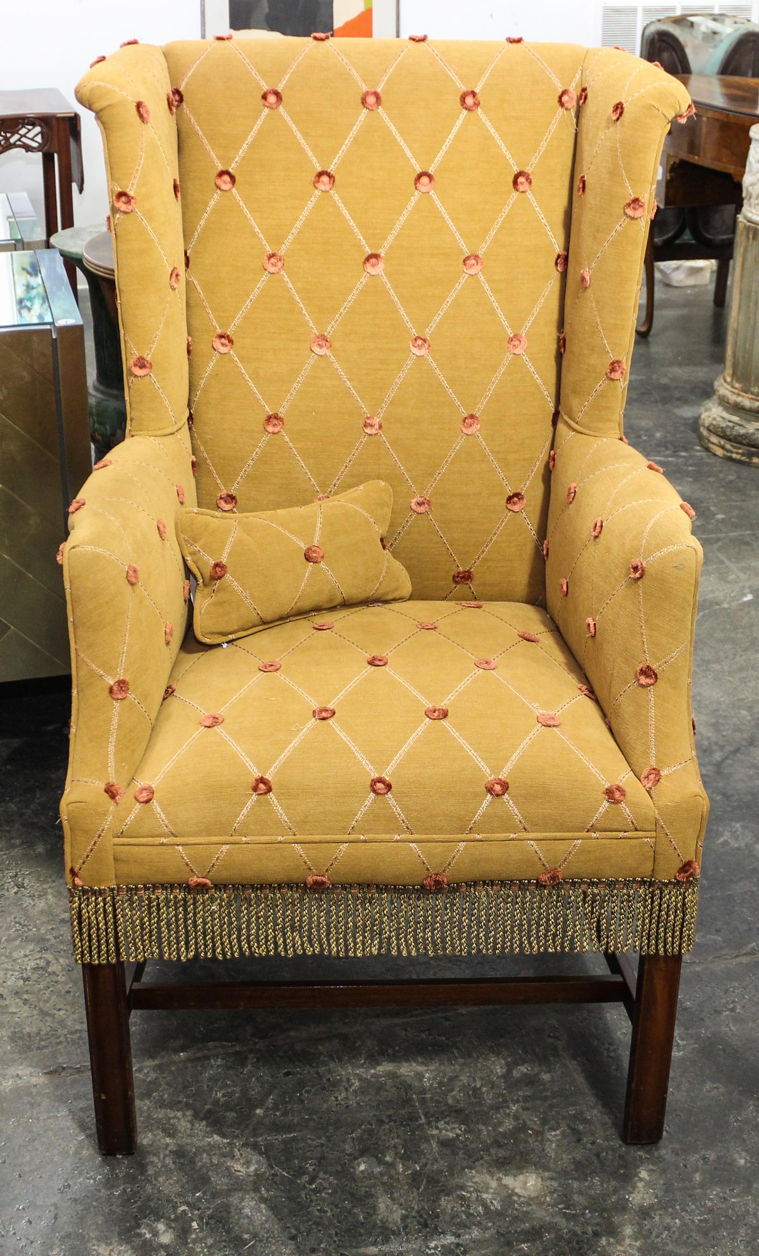 A George III Style Mahogany Wingback Chair. Height of chair 45 1/2 inches.
