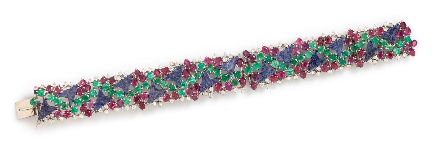 A 14 Karat White Gold, Lapis Lazuli, Ruby, Emerald and Diamond Bracelet, 31.80 dwts.