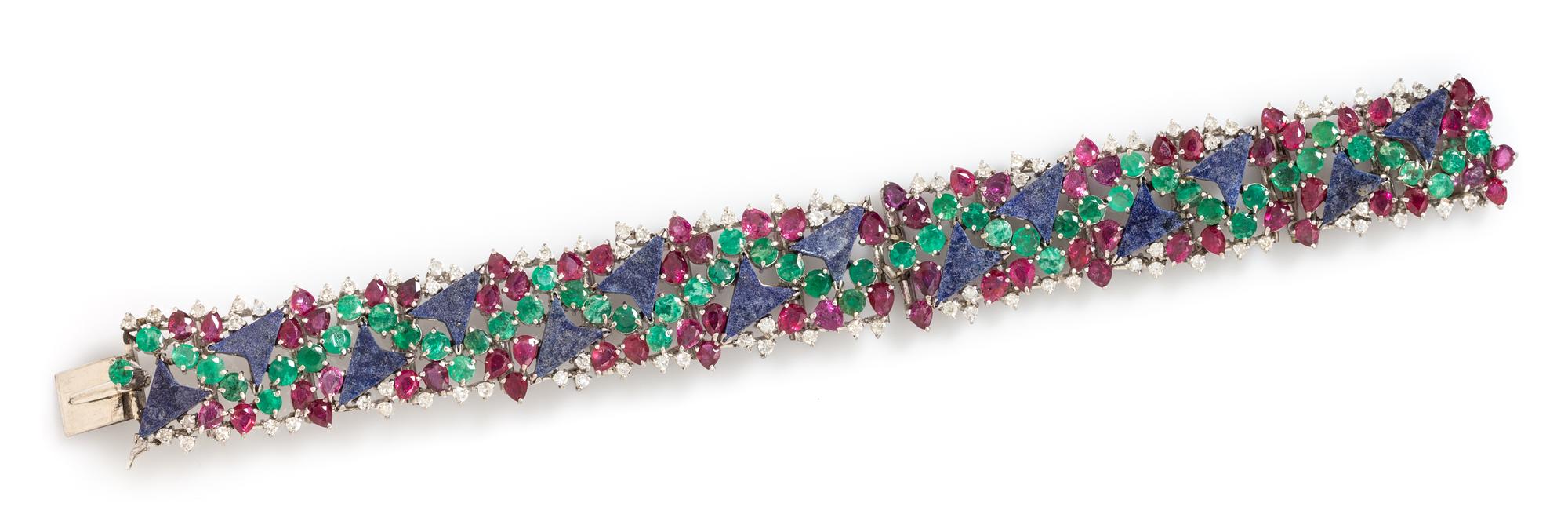 A 14 Karat White Gold, Lapis Lazuli, Ruby, Emerald and Diamond Bracelet, 31.80 dwts.