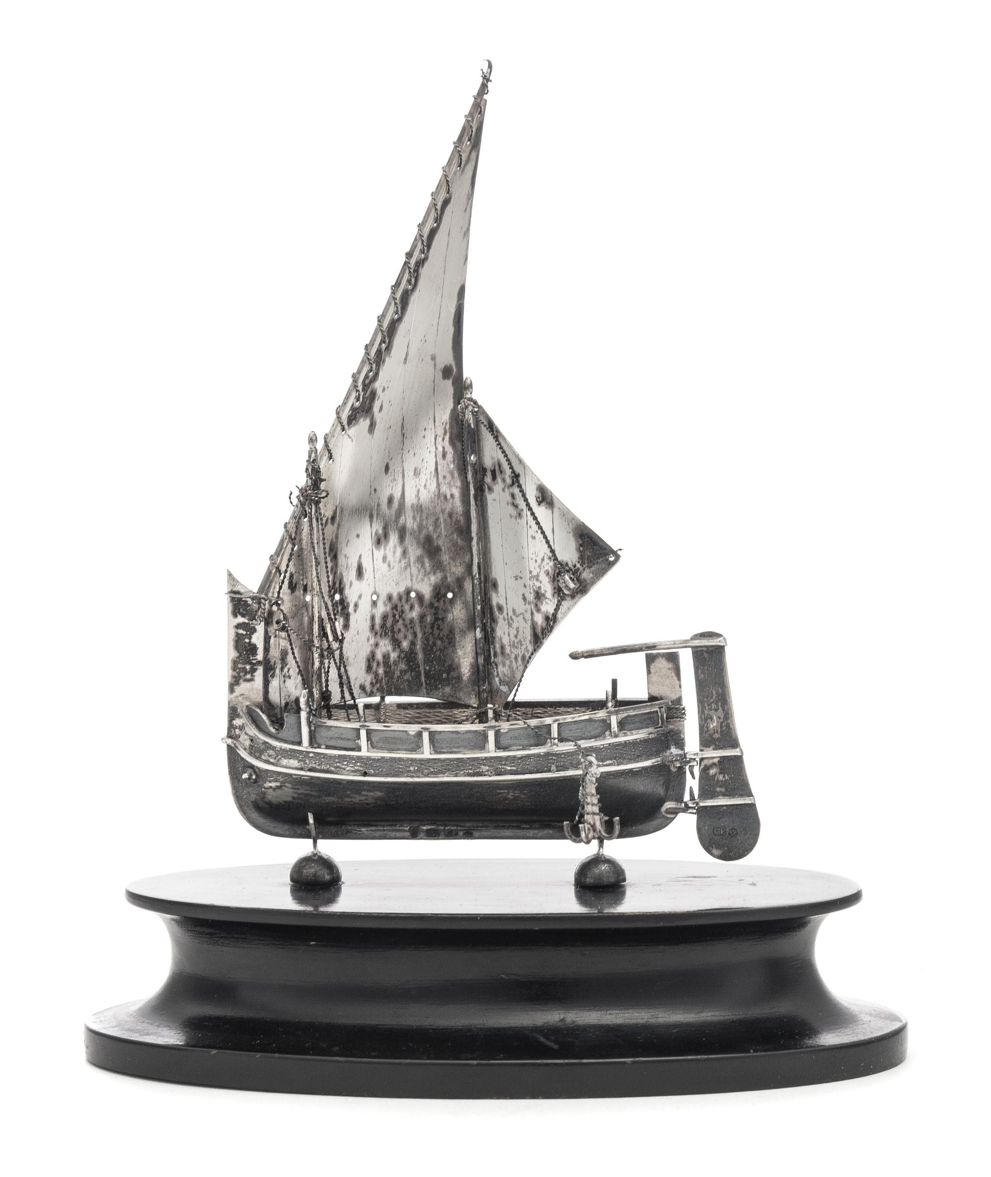 A Continental Silver Nef, Likely Dutch, Maker's Mark F.P., Late 19th/Early 20th Century, mounted to a wood base.