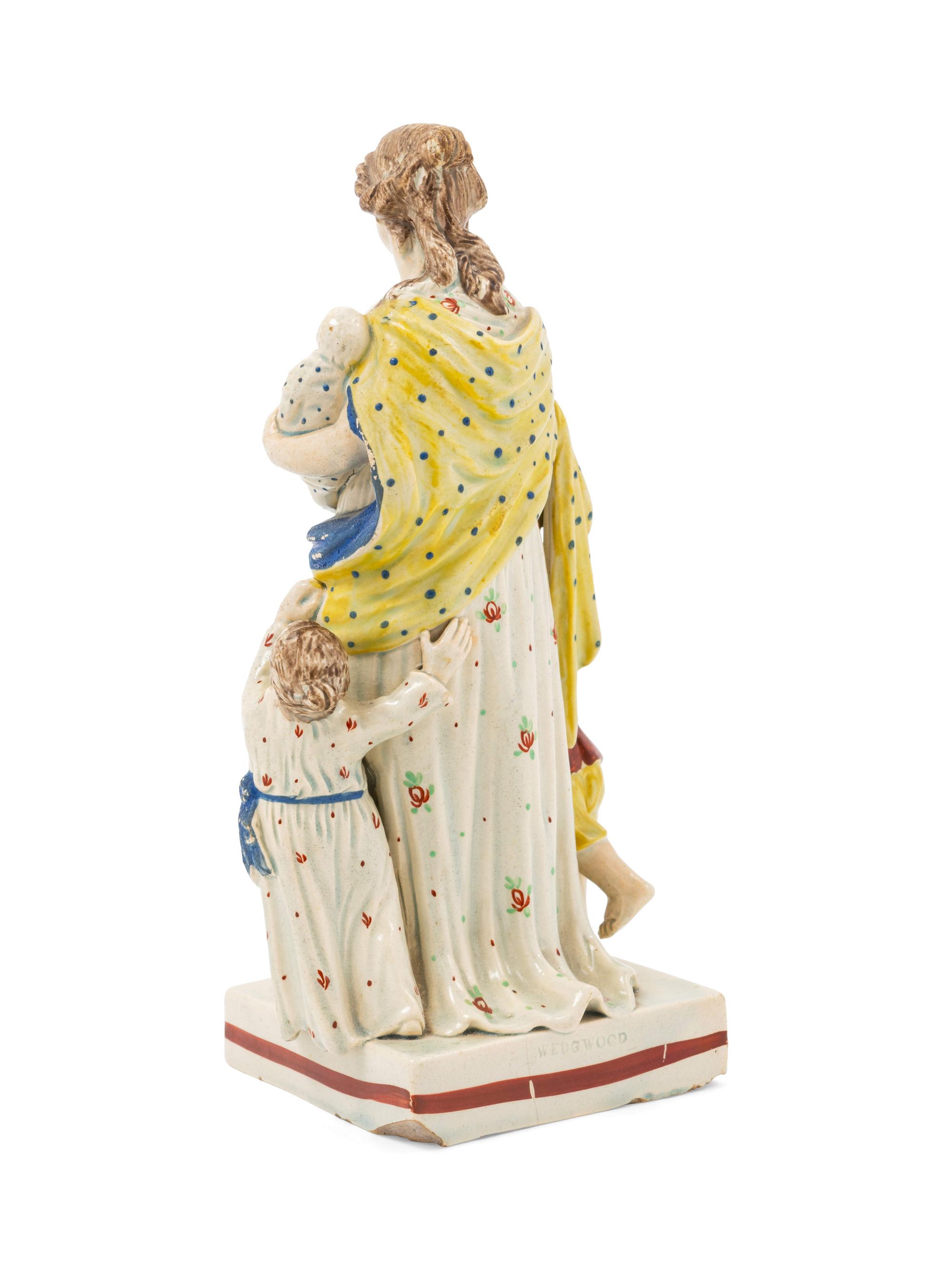 A Staffordshire Pottery Figure of Charity
