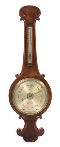 An English Mahogany Wheel Barometer Thermometer, T.U. Gray, Height 39 inches.
