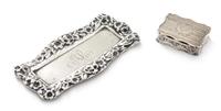 A Victorian Silver Vinaigrette, Robert Thornton, Birmingham, 1870, having a shaped rectangular case, the lid centered by an envgaved mo
