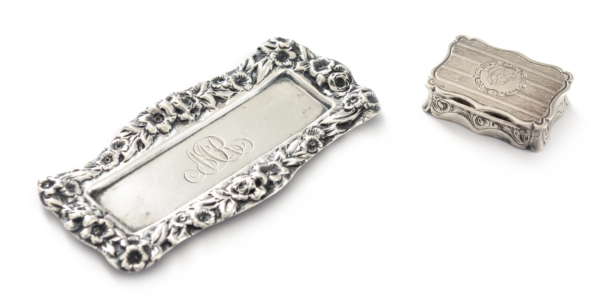 A Victorian Silver Vinaigrette, Robert Thornton, Birmingham, 1870, having a shaped rectangular case, the lid centered by an envgaved mo