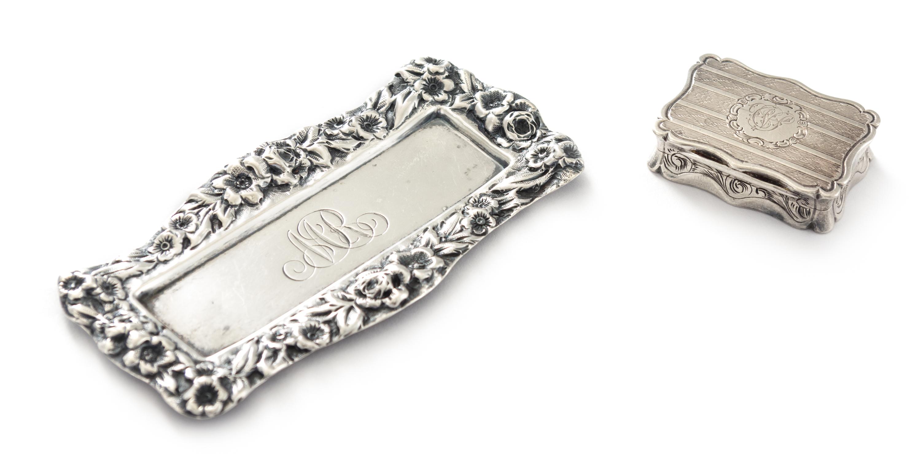 A Victorian Silver Vinaigrette, Robert Thornton, Birmingham, 1870, having a shaped rectangular case, the lid centered by an envgaved mo